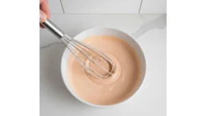 Cookout Sauce Recipe: Easy, Creamy Southern-Style Sauce for BBQ, Burgers & Fries 8 Cookout sauce being whisked until smooth and creamy texture