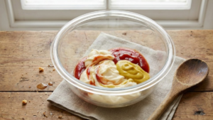 Cookout Sauce Recipe: The Creamy Southern Dip Americans Can’t Stop Loving 4 Mayonnaise, ketchup, and yellow mustard added to a glass mixing bowl