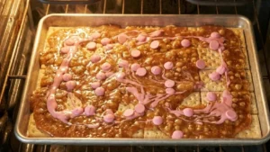 Valentine’s Day Crack Candy – The Sweet & Salty Treat Everyone Is Obsessed With 9 Adding pink candy melts to Valentine crack candy