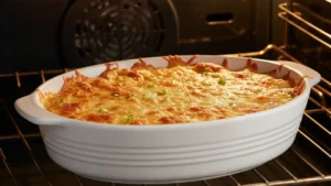 Crab rangoon dip baking until hot and bubbly in the oven