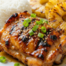 Molokai chicken served with rice and grilled pineapple.
